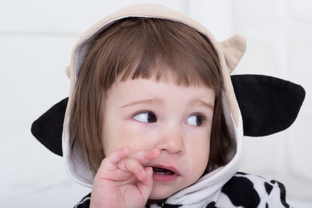 Baby in cow costumeの写真素材