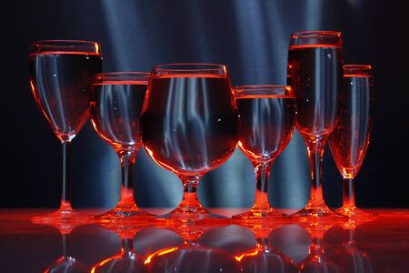 six glasses with water in lightの写真素材