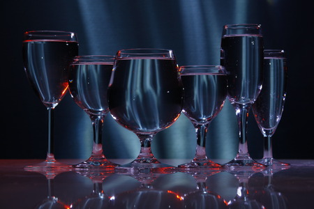 six glasses with water in lightの写真素材