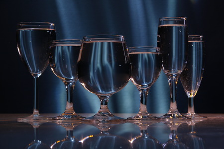 six glasses with water in lightの写真素材
