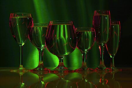 six glasses with water in lightの写真素材