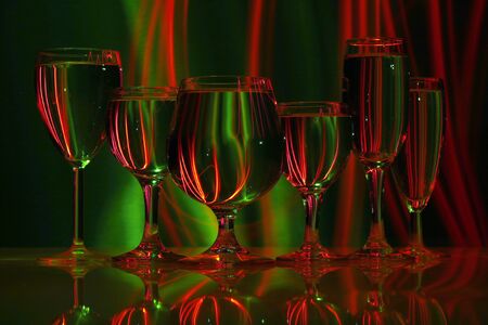 six glasses with water in lightの写真素材