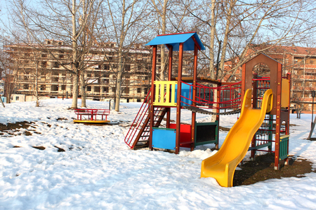snowy playground in an urban park in Piedmont Italyの写真素材