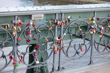 love padlocks hanging in the railing on the bridgeのeditorial素材