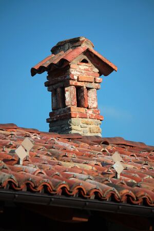 view of the chimney above the roof houseの写真素材