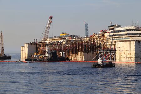 GIGLIO ISLAND, ITALY - JULY 19, 2014: Front view of the wreck of the Costa Concordia on July 19, 2014 in Giglio Island, Italy.のeditorial素材