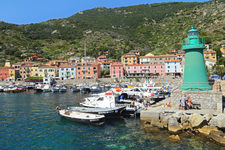 GIGLIO ISLAND, ITALY - JULY 19, 2014 Boats in the small harbor of Giglio Island, the pearl of the Mediterranean Sea, Tuscany - Italyのeditorial素材