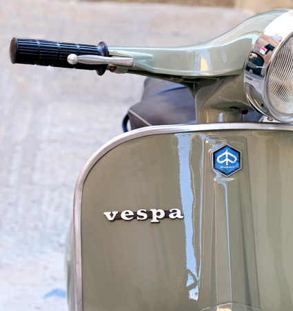 PORTO SANTO STEFANO, ITALY - JULY 18, 2014  classic Vespa is one of the products of the industrial design worldのeditorial素材