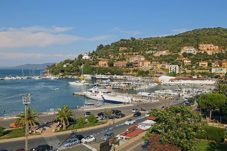 GIGLIO ISLAND, ITALY - JULY 18, 2014 Boats in the small harbor of  Porto Santo Stefano , the pearl of the Mediterranean Sea, Tuscany - Italyのeditorial素材