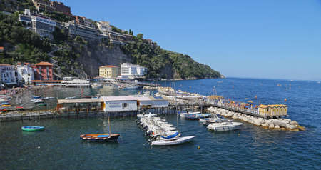 SORRENTO, ITALY -14 SEPTEMBER 2014: The small haven with fishing boats and colorfull houses is located on Via del Mare in Sorrento, aside from the fashionable resort, on September 14, 2014 in Italyのeditorial素材