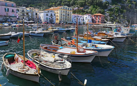 SORRENTO, ITALY -14 SEPTEMBER 2014: The small haven with fishing boats and colorfull houses is located on Via del Mare in Sorrento, aside from the fashionable resort, on September 14, 2014 in Italyのeditorial素材