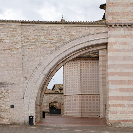 Facade of St. Claire Cathedral in Assisiの写真素材