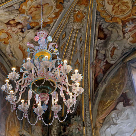 URBINO,  ITALY - JANUARY 3, 2019: crystal chandelier at the Oratorio di Santo Giuseppe or Oratory of St. Josephのeditorial素材