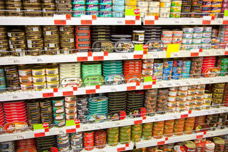 Kaliningrad, Russia - January 31, 2021: Canned fish on supermarket shelves.のeditorial素材