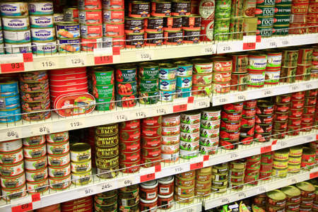 Kaliningrad, Russia - January 31, 2021: Canned fish on supermarket shelves.のeditorial素材