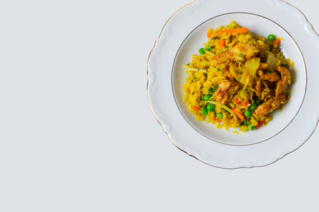 Rice pans on white plate against white backgroundの写真素材