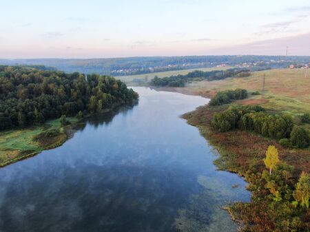 Aerial view of the landscape is a beautiful river at sunset in summer in clear weather.