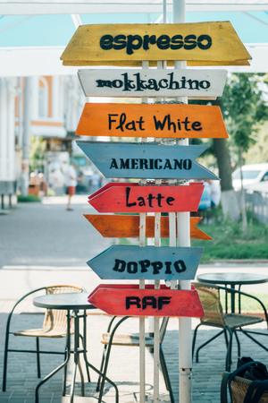 Sign menu coffee drawn on wooden colorful boards outsideの写真素材