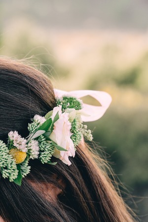 Woman in white dress standing field wearing flower crown Young forest inspired bride, bohemian girl