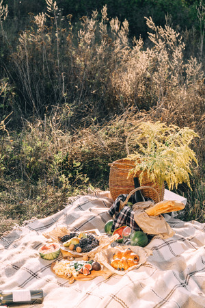 Summer Picnic at sunset on the plaid, food and drink conception lifestyleの写真素材