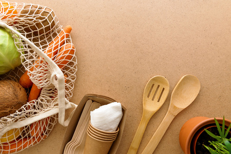Flat lay zero waste products, natural lifestyle at kitchen. Reusable shopping bag, wooden