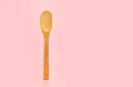 Ecological wooden cutlery on pink background. Concept zero waste. Eco friendlyの写真素材