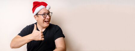 Happy Christmas Santa Claus showing thumb up. Isolated on white background. Lifestyle. Copy spaceの写真素材