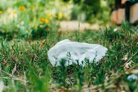 plastic bag in grass. Ecology problem. Summerの写真素材