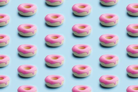 Seamless Pattern Of pink Topping Donuts On Pastel blue Background. design trendy food conceptの写真素材