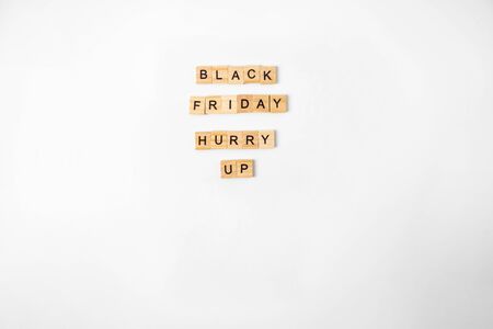 Black friday text on wooden blocks and cup of coffee. top viewの写真素材
