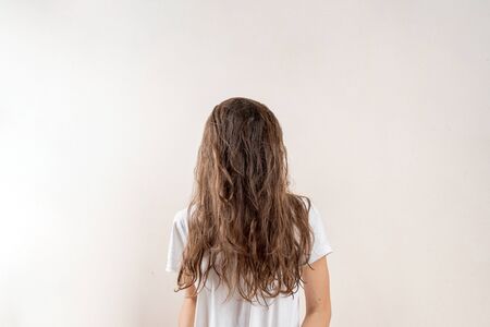 No face portrait of young woman with brown messy hair. Sleepy conceptの写真素材