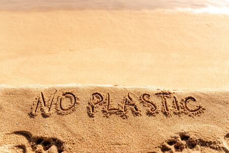 No Plastic text hand written on sandy beach background.の写真素材