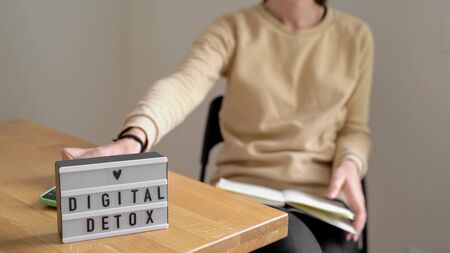 Digital detox day of young beautiful caucasian woman. Drinking coffee without phone. Addictionの写真素材