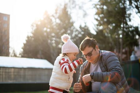 Young caucasian father with child spend time outdoors. Local travel for weekends. Single fatherの写真素材