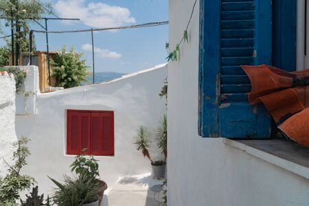 Anafiotika neighborhood in Athens near Acropolis hill. Travel destination. White houses and blue windowsの写真素材