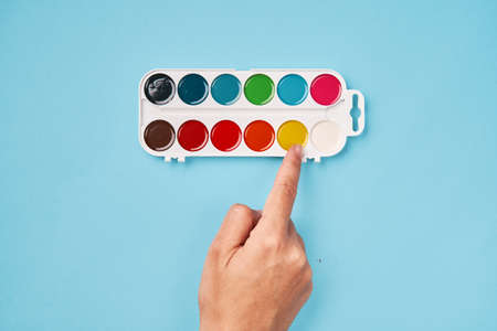 Top view of watercolor paint on blue background. back to schoolの写真素材