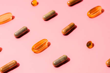 Top view of pills on pinkの写真素材
