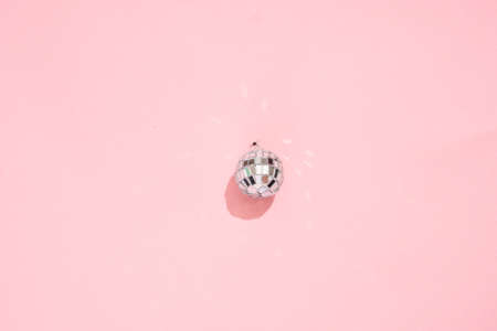 disco ball minimal on pink background. 90s retro party concept.の写真素材