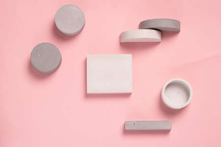 Top view of geometric shaped on pastel pink background. modern style.