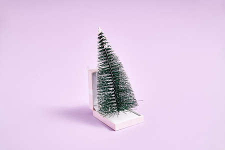Christmas tree in white jewelry box. Marriage proposal on christmas or new year nightの写真素材