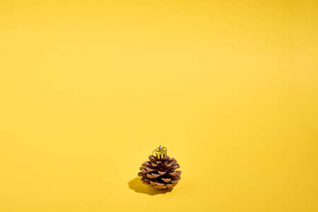 Pine cone craft as tree bauble. Christmas gift on a budget. Sustainable eco plastic free lifestyle