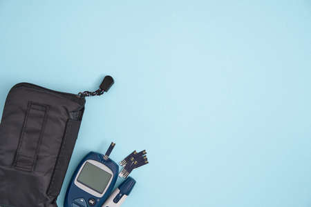 Top view of blood test measuring equipment. Glucose blood test. Metabolic syndrome diagnosis.