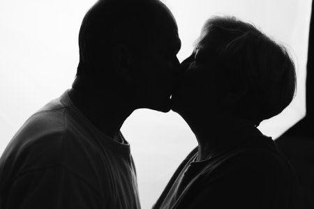 Elderly couple hugging in black and white colors. Happy loving caring people. Caucasian retired man...