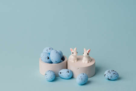 quail blue easter eggs on blue background. Minimal comcept with copy space. spring holidays decor....