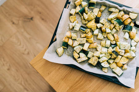 Healthy food background. Less meat concept. Vegetarian food on wooden background. Backing sheet with...
