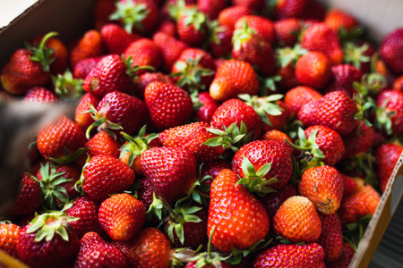Strawberry top view background. Summer food pattern. Raw fresh farming berries. Healthy eating...