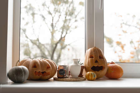 Carved pumpkins for halloween. home decor on window. thanksgivingの写真素材
