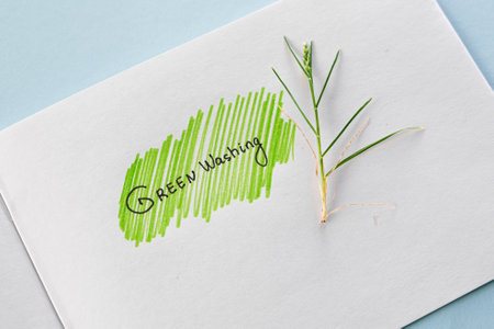 Greenwashing concept. Drawing on paper with text and green marker strokes. Environmental marketing...