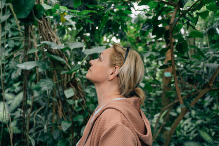 Middle age profile view woman portrait in jungles with closed eyes. Meditation mental health conceptの写真素材