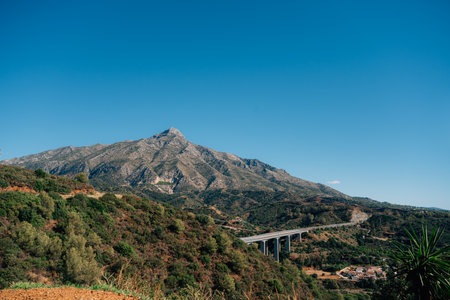 Scenic view of la concha mountain and verdant landscape under clear blue skyの写真素材